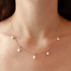 Necklace with Sliding Pearl Drops.